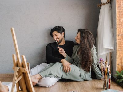 A person meditating peacefully by a window.