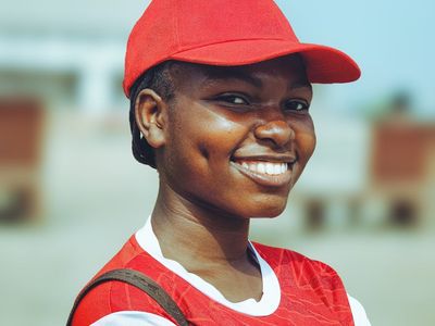 Smiling individual in comfortable sportswear looking refreshed.